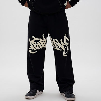 Black sweatpants with white text design on a white background